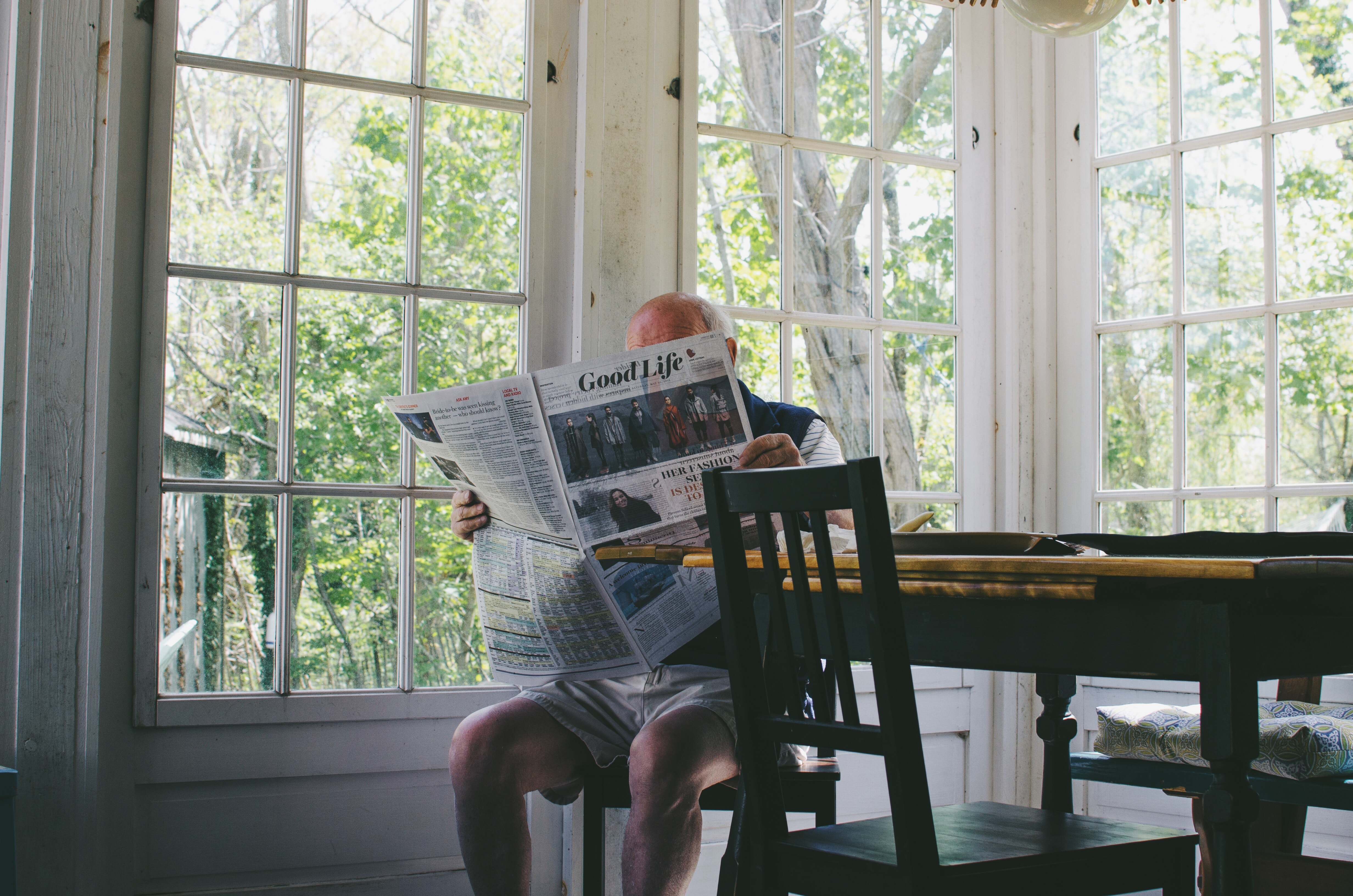 man reading newspaper  generation x